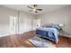 Spacious main bedroom with hardwood floors, ceiling fan, closet and ensuite bathroom at 2490 Turtle Ter, Grayson, GA 30017