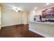 Open-concept kitchen with granite countertops, stainless steel appliances, and a view into the living area at 507 Highwood Ln, Atlanta, GA 30344