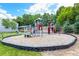 Community playground with a slide, climbing area, and soft ground at 507 Highwood Ln, Atlanta, GA 30344
