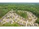 Stunning aerial view of a neighborhood featuring new homes and lush green trees at 571 Hancock Se Dr, Atlanta, GA 30354