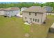 Well-maintained backyard with a stone patio, seating area, and lush green lawn at 571 Hancock Se Dr, Atlanta, GA 30354