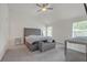 Bright bedroom featuring high ceilings, carpet, and a comfortable bed at 571 Hancock Se Dr, Atlanta, GA 30354