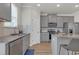 Bright kitchen showcasing stainless steel appliances, a kitchen island, and grey cabinets at 571 Hancock Se Dr, Atlanta, GA 30354