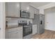 Grey kitchen featuring stainless steel appliances and granite countertops at 571 Hancock Se Dr, Atlanta, GA 30354