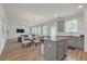 Open kitchen and living area with hardwood floors, modern appliances, an island, and eat in kitchen space at 571 Hancock Se Dr, Atlanta, GA 30354
