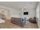 Spacious living room with hardwood floors, a ceiling fan, and large windows at 571 Hancock Se Dr, Atlanta, GA 30354