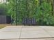 Community mailboxes on a concrete pad surrounded by trees in a serene setting at 571 Hancock Se Dr, Atlanta, GA 30354