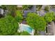 Serene aerial view of a community pool, set amidst lush green trees and manicured lawns, creating a tranquil residential setting at 6900 Roswell Rd # J2, Atlanta, GA 30328
