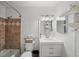 Traditional bathroom with a shower-tub combo, vanity with storage, and neutral-toned tile at 6900 Roswell Rd # J2, Atlanta, GA 30328
