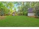 Backyard with lush lawn and a playground at 893 E Rock Springs Ne Rd, Atlanta, GA 30306