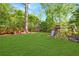 Spacious backyard featuring a lush green lawn and a fun playground area at 893 E Rock Springs Ne Rd, Atlanta, GA 30306