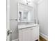Bathroom features marble countertop vanity, decorative mirror, and neutral walls at 893 E Rock Springs Ne Rd, Atlanta, GA 30306