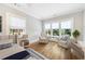 Bright bedroom featuring hardwood floors, large windows with natural light, and comfortable seating for relaxation at 893 E Rock Springs Ne Rd, Atlanta, GA 30306