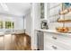 Butler pantry with a beverage fridge, storage, and coffee station near backyard at 893 E Rock Springs Ne Rd, Atlanta, GA 30306