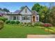 Charming home with stone accents, lush landscaping, and a well-manicured lawn at 893 E Rock Springs Ne Rd, Atlanta, GA 30306