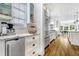 Bright kitchen with stainless steel refrigerator, and opens into a larger living space at 893 E Rock Springs Ne Rd, Atlanta, GA 30306