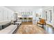 Open-concept living area showcases a modern kitchen, hardwood floors, and stylish furniture at 893 E Rock Springs Ne Rd, Atlanta, GA 30306