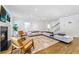 Bright open-concept living room with fireplace, comfortable sofas, and stairs to upper level at 893 E Rock Springs Ne Rd, Atlanta, GA 30306
