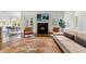 Cozy living room features a fireplace, plush seating, and adjacent dining area at 893 E Rock Springs Ne Rd, Atlanta, GA 30306