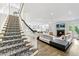 Spacious living room with a fireplace, modern decor, and open access to the kitchen and dining areas at 893 E Rock Springs Ne Rd, Atlanta, GA 30306