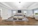 Expansive main bedroom features hardwood floors, tray ceilings, elegant lighting, and a calming color palette for relaxation at 893 E Rock Springs Ne Rd, Atlanta, GA 30306