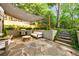 Relaxing patio features stone flooring, outdoor seating, a grill, and shade covering with yard access steps at 893 E Rock Springs Ne Rd, Atlanta, GA 30306