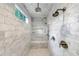 Luxurious shower room with floor-to-ceiling marble, multiple shower heads, built-in bench, and recessed niche at 893 E Rock Springs Ne Rd, Atlanta, GA 30306