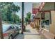 A sidewalk view of a street lined with storefronts and trees, and parked cars at 893 E Rock Springs Ne Rd, Atlanta, GA 30306