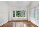 Sun-filled room with hardwood floors and large windows offering scenic views at 893 E Rock Springs Ne Rd, Atlanta, GA 30306