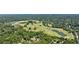 Lush golf course with mature trees, a winding layout, and a serene lake, surrounded by a dense forest at 101 Ardmore Nw Pl # 3, Atlanta, GA 30309