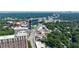 Expansive aerial view featuring the city skyline, modern buildings, and a vibrant green neighborhood at 101 Ardmore Nw Pl # 3, Atlanta, GA 30309