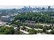 Stunning aerial view of the community, showcasing lush greenery and the downtown skyline at 101 Ardmore Nw Pl # 3, Atlanta, GA 30309