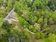 Overhead shot of a green neighborhood with walking paths, a creek and bridge, surrounded by dense trees at 101 Ardmore Nw Pl # 3, Atlanta, GA 30309
