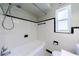 Bright bathroom featuring white tile, a shower-tub combination, and classic fixtures at 101 Ardmore Nw Pl # 3, Atlanta, GA 30309