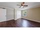 A bedroom with hardwood floors, a double door closet, and ample natural light from a window at 101 Ardmore Nw Pl # 3, Atlanta, GA 30309