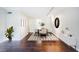Bright dining room featuring hardwood floors, a stylish rug, and a modern light fixture at 101 Ardmore Nw Pl # 3, Atlanta, GA 30309
