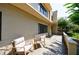 This condo has a front patio with outdoor seating, surrounded by mature landscaping, creating a relaxing outdoor space at 101 Ardmore Nw Pl # 3, Atlanta, GA 30309
