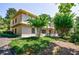 Two story brick condo surrounded by mature trees and lush landscaping in a well-maintained community at 101 Ardmore Nw Pl # 3, Atlanta, GA 30309