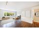 Inviting living room with hardwood flooring, neutral paint, modern decor, and a sunlit window at 101 Ardmore Nw Pl # 3, Atlanta, GA 30309