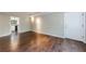Bright, neutral living room featuring beautiful hardwood floors and a modern track lighting system at 101 Ardmore Nw Pl # 3, Atlanta, GA 30309