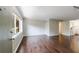 Living room with hardwood floors, a large window for natural light, and access to a bright, tiled kitchen at 101 Ardmore Nw Pl # 3, Atlanta, GA 30309