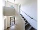 Stairwell with carpeted stairs and handrail, leading to a bright entrance and an exterior door at 101 Ardmore Nw Pl # 3, Atlanta, GA 30309