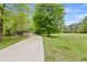 Scenic walking path featuring a bridge, beautiful trees, and adjacent green space offers a tranquil outdoor experience at 101 Ardmore Nw Pl # 3, Atlanta, GA 30309