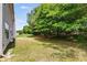 Lawn adjacent to the house and trees at 1492 Saint George, Conyers, GA 30012