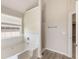 Bright bathroom featuring a tub with tile surround, wood-look floors, and a separate shower area at 1492 Saint George, Conyers, GA 30012