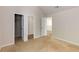 Bedroom featuring neutral carpet, multiple doorways, and fresh neutral paint at 1492 Saint George, Conyers, GA 30012