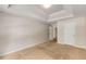 Spacious bedroom featuring tray ceiling, neutral carpet, and fresh neutral paint at 1492 Saint George, Conyers, GA 30012