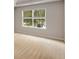 Bedroom featuring neutral carpet, a window, and fresh neutral paint at 1492 Saint George, Conyers, GA 30012