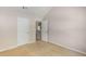Bedroom featuring neutral carpet, multiple doorways, and fresh neutral paint at 1492 Saint George, Conyers, GA 30012