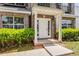 Welcoming entrance with a white door, pillars, and manicured shrubs at 1492 Saint George, Conyers, GA 30012
